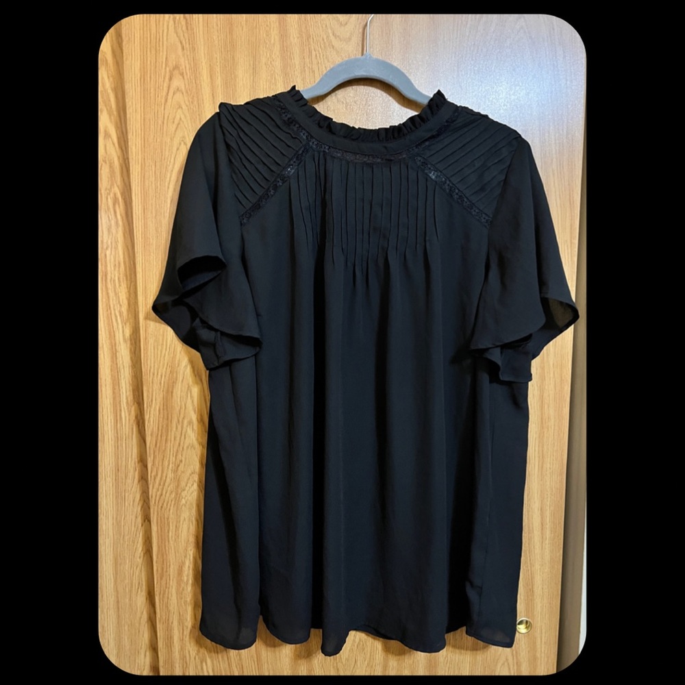 NWOT Torrid black blouse with embroidery accents. Size 2